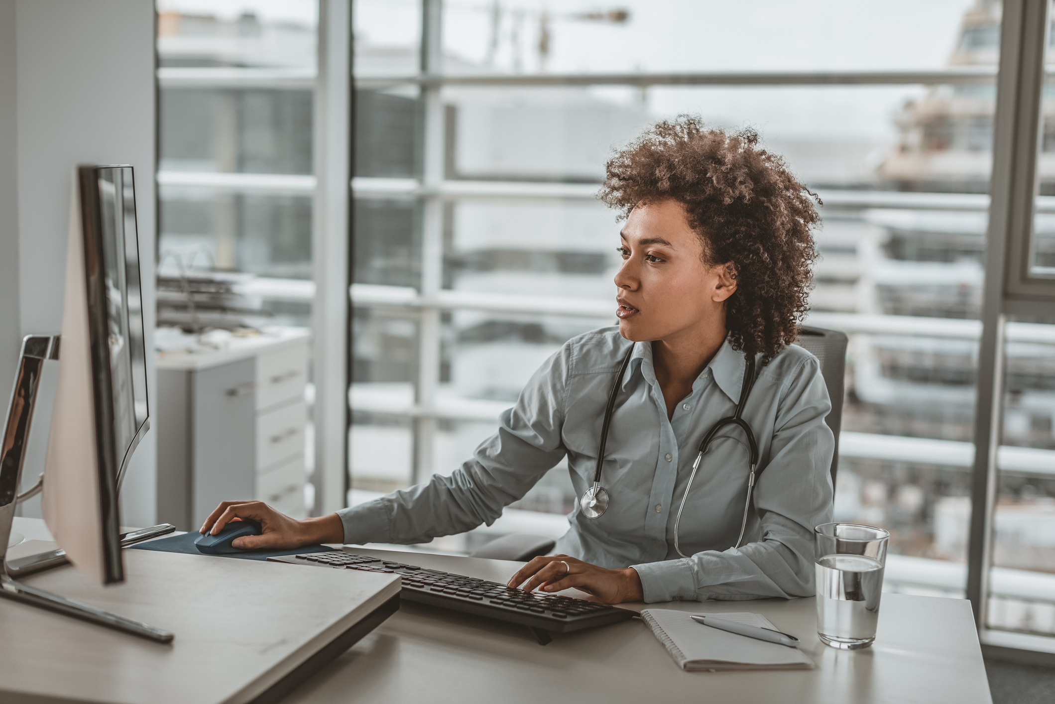 Female physician at laptop