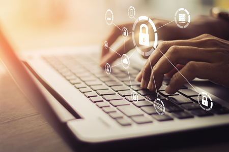 image of secure lock over hands on keyboard