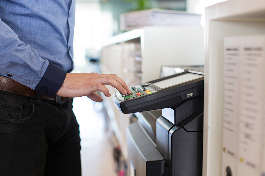 Male using copy machine 