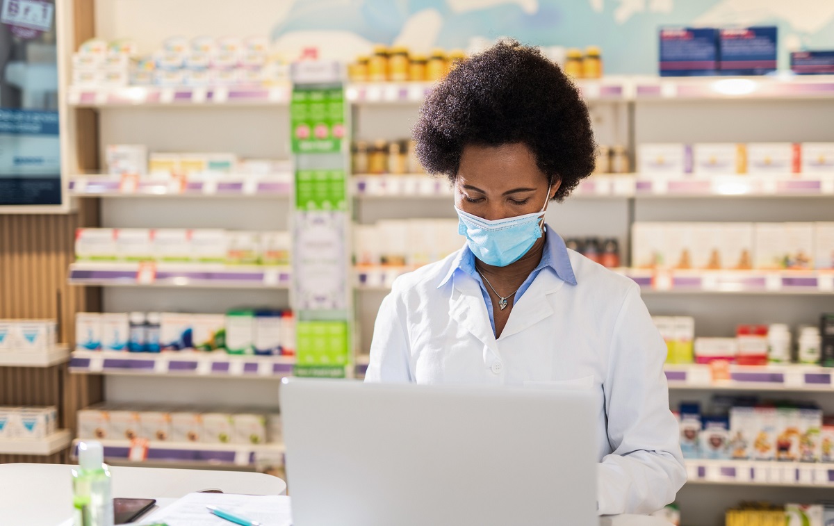 Pharmacist working on laptop 