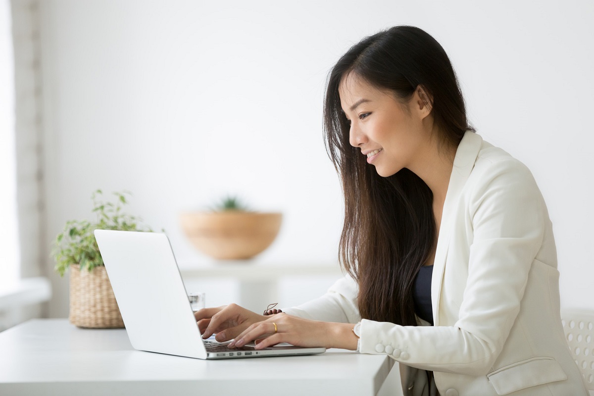 Woman typing on laptop