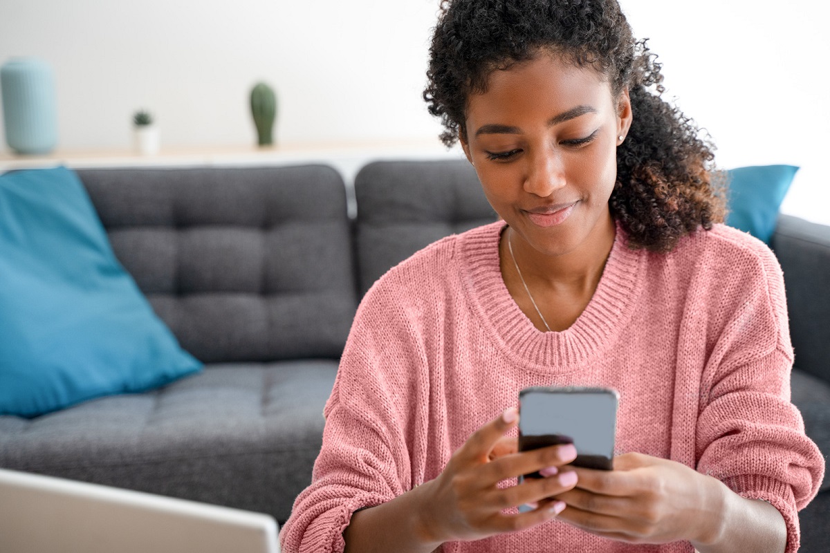 Teenager looking at Smartphone