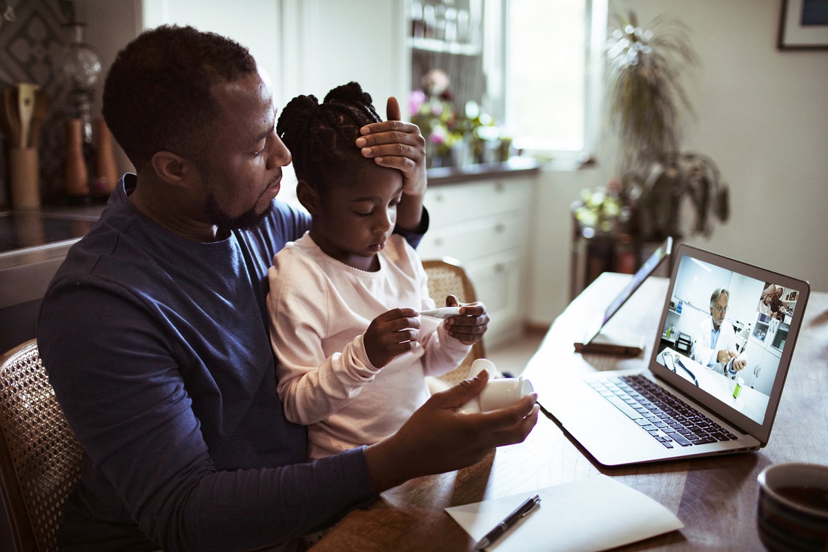 Father and Daughter on Virtual Care appointment