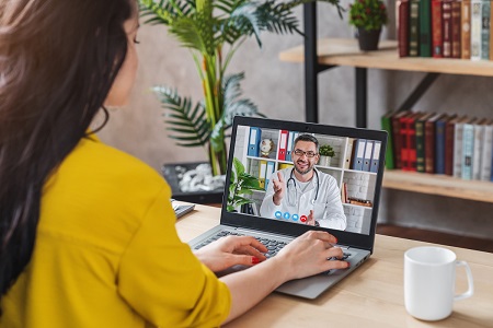 virtual visit with male doctor on laptop