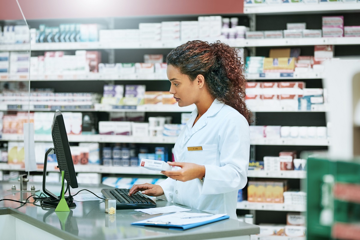 Female pharmacist at computer